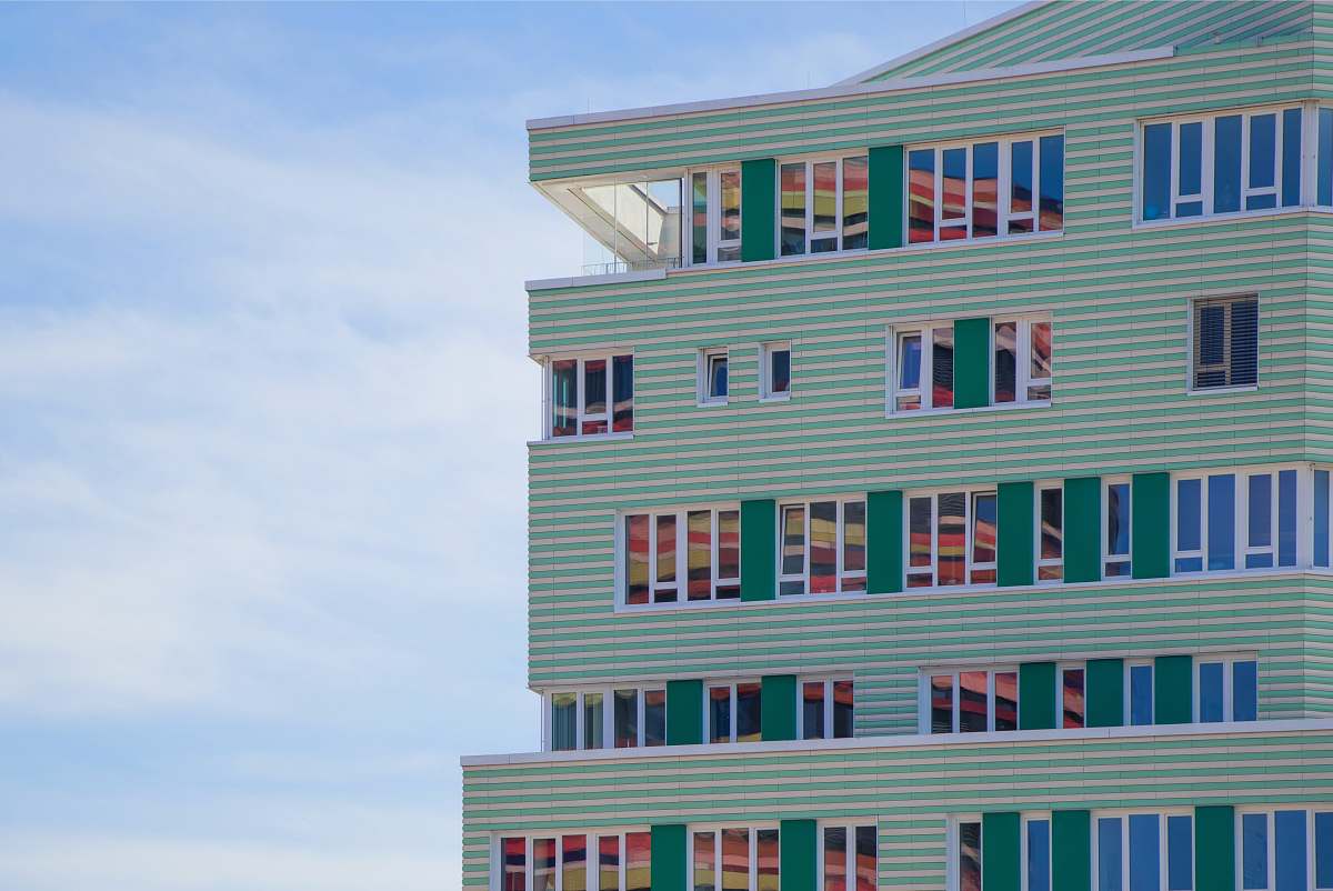 high rise green and blue concrete building urban
